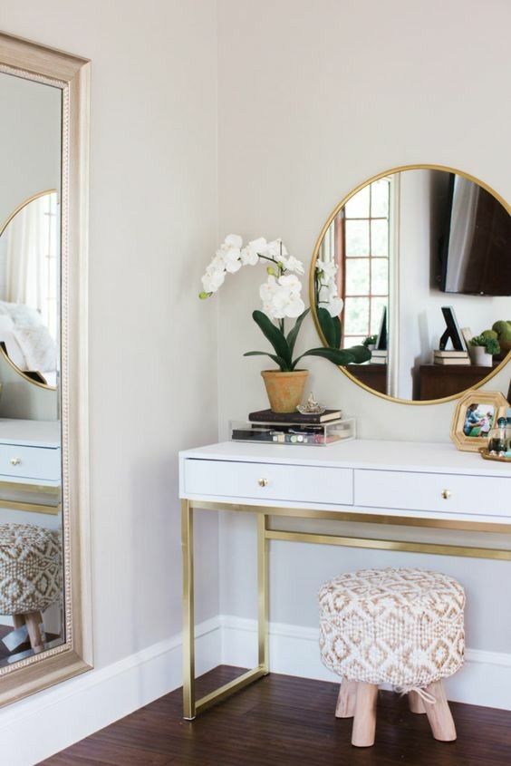 a stylish and elegant vanity with an upholstered stool, which doens't take much space