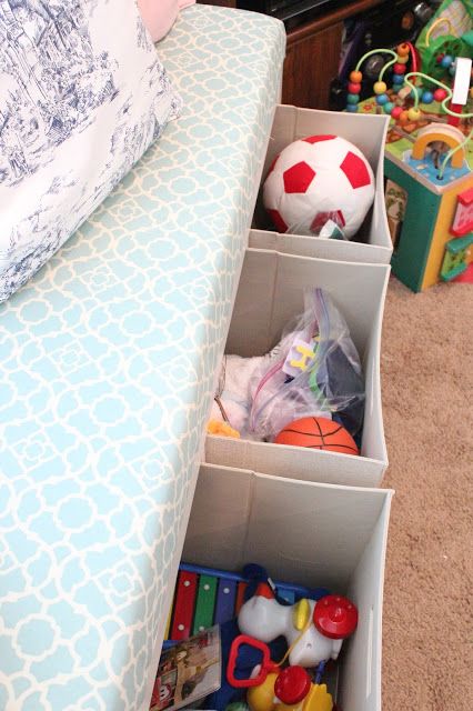 place stome Drona boxes under the kid's bed to add comfy storage and delcutter the room
