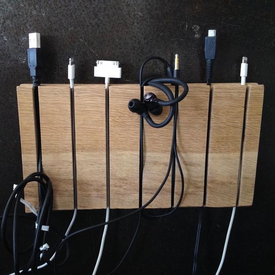 such a magnetic strip can be used to organize the cords, too, it's a stylish and modern idea