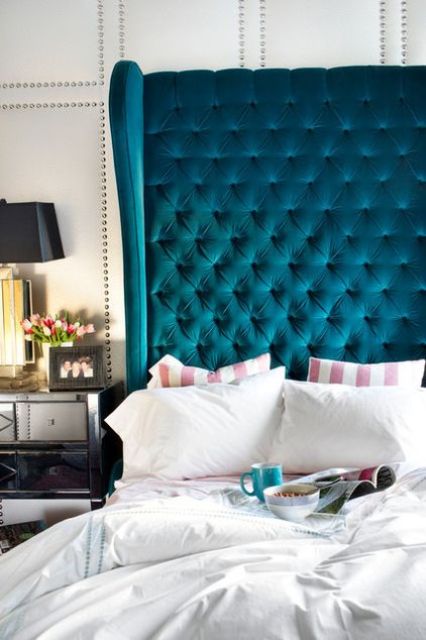 a statement teal tufted headboard is a thing that will be always in trend and will add a sophisticated touch