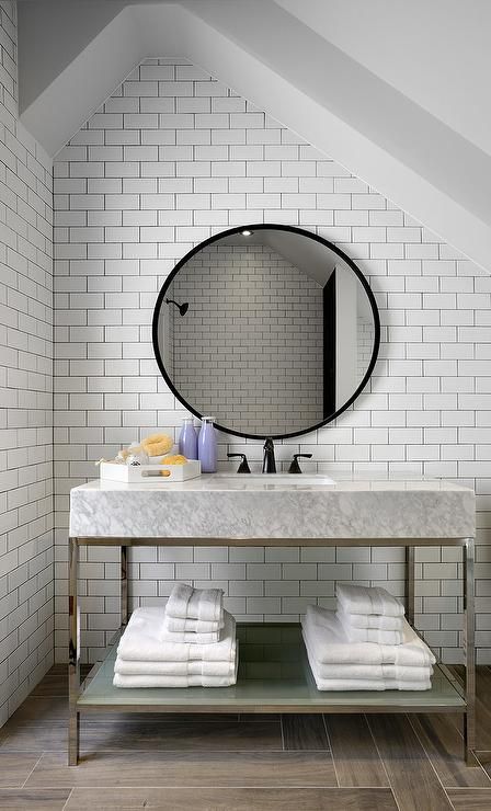 a vanity of a stone top and a frosted glass shelf underneath looks contemporary and bold