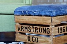 24 an industrial ottoman made of a stained Knagglig box with letters, with a denim seat and casters