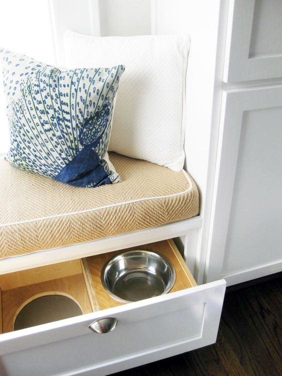 an upholstered kitchen windowsill bench can contain drawers with your pets' bowls