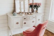 25 a vintage vanity and a pink upholstered chair by it as a colorful touch and a seating piece