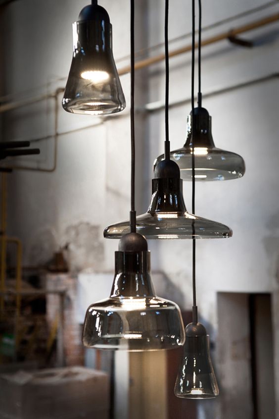 such a smoked glass pendant lamps cluster will bring an edgy feel to any space in your home