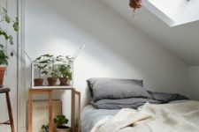 25 such an attic bedroom with much potted greenery creates a cozy and relaxing sleeping space