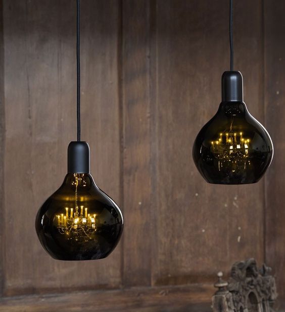 unique pendant lamps of smoked glass and with vintage refined chandeliers inside will be a conversation starter in your space