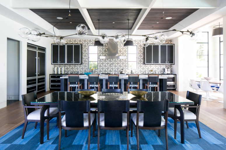 This gorgeous beach home pairs traditional and modern and features a cool color palette with blues