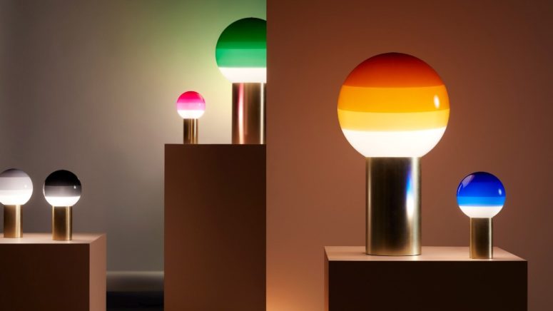 The lamps show off various colors, from grey to emerald and several sizes