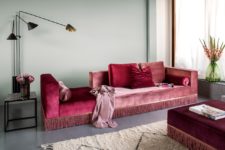 02 The living room is styled with adorable velvet furniture in jewel tones with fringe
