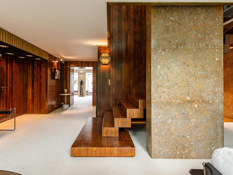 Wood, steel, stone, terrazzo and glass make up a stylish modern duplex with a touch of chic