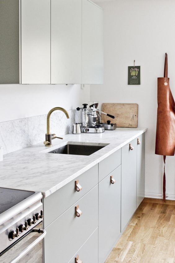 leather handles will add an edgy touch to your kitchen giving it a modern feel at once