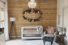 02 make a statement wall clad with wood for a cozy rustic touch in your baby’s space