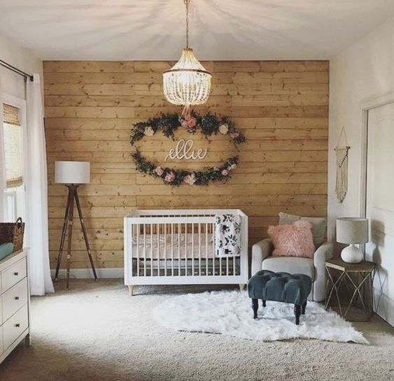make a statement wall clad with wood for a cozy rustic touch in your baby's space
