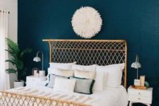 03 a neutral bedroom can be spruced up with a navy statement wall for a chic and bold look