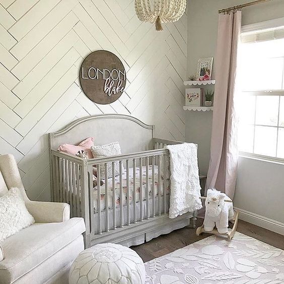 a statement wall clad with whitewashed wood is a great idea for a neutral or pastel nursery