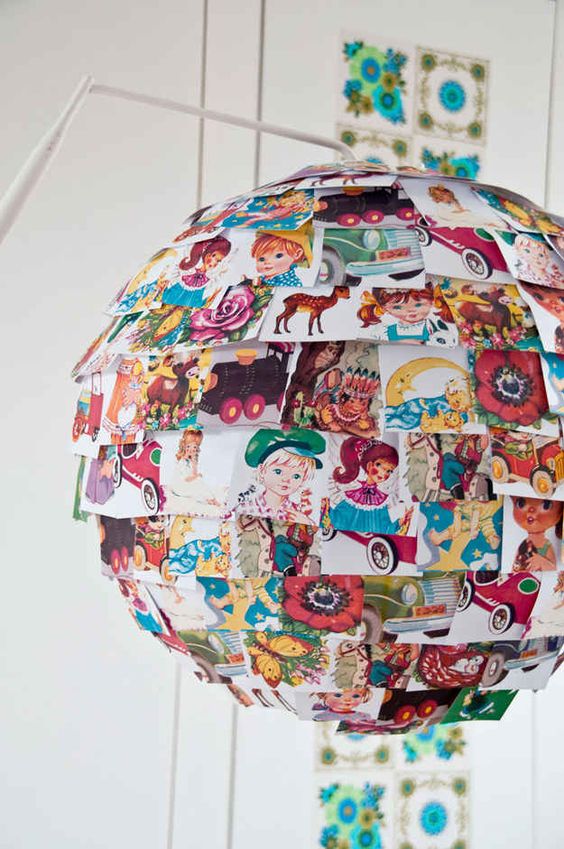 an IKEA Rgolit lampshade personalized with colorful vintage picture books is a veyr whimsical hack