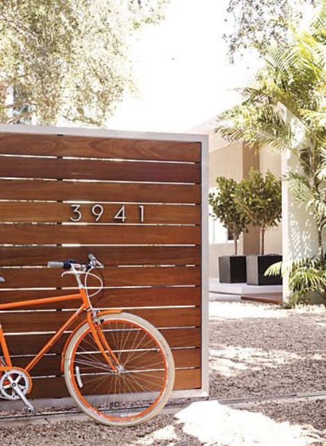 place the house numbers on the fence that is hiding your home and outdoor space from neighbors' eyes