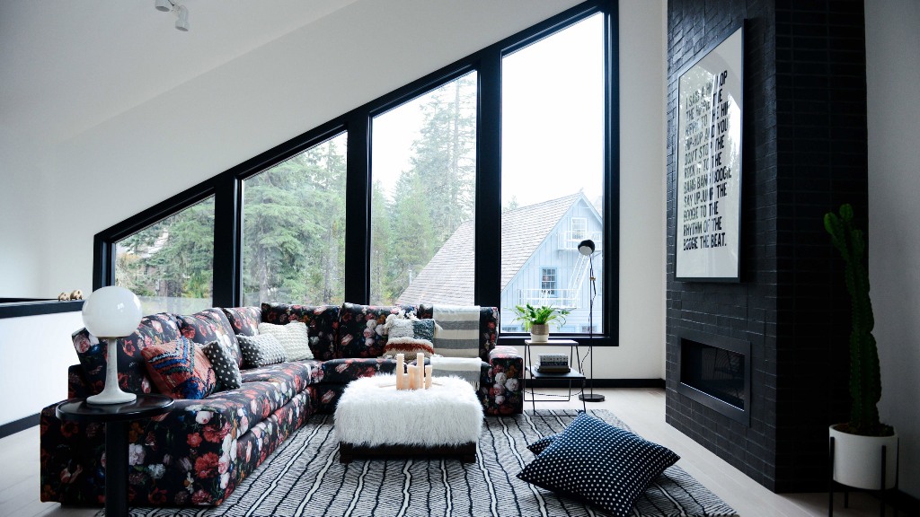 This is a cozy attic space with graphic touches and much light coming from outside