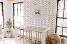 04 a gender-neutral minimal boho nursery with a printed statement wall that looks bold