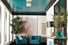 04 a super bright turquoise ceiling and matching chairs and accessories are a great color statement in the space
