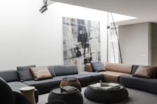 a living room that features a super large sectional sofa