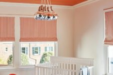 05 a bright orange ceiling, a matching chair and drawer to create a bold and welcoming kid’s room