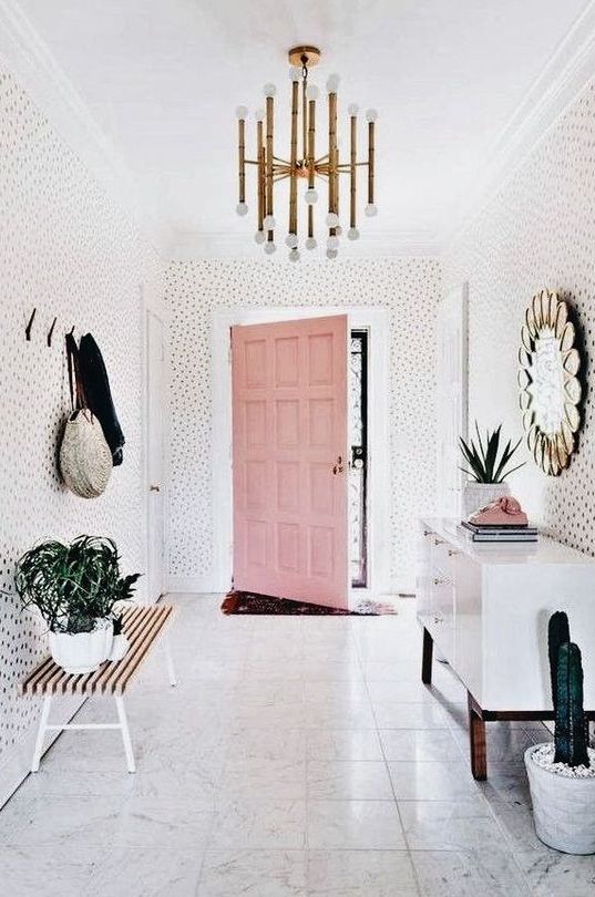 a whole entryway done with whisy spotted wallpaper is a very fun and playful idea