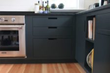 06 Douglas fir wood floor and graphite grey kitchen cabinets create a bold and chic modern look