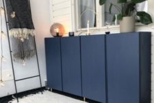 06 IKEA Ivar cabinets painted navy and with gold legs look chic and elegant, with a modern twist