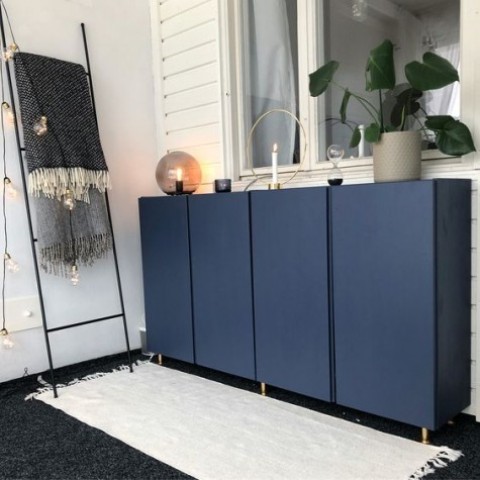 IKEA Ivar cabinets painted navy and with gold legs look chic and elegant, with a modern twist