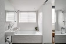 a small yet cute bathroom in white