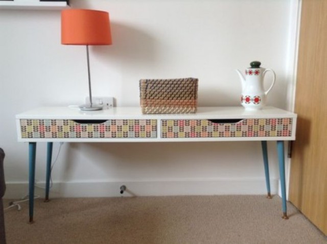 a colorful Ekby Alex shelf hack with blue legs and decoupage drawers will fit any mid-century modern space