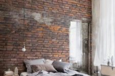 bedroom design with a stylish brick wall