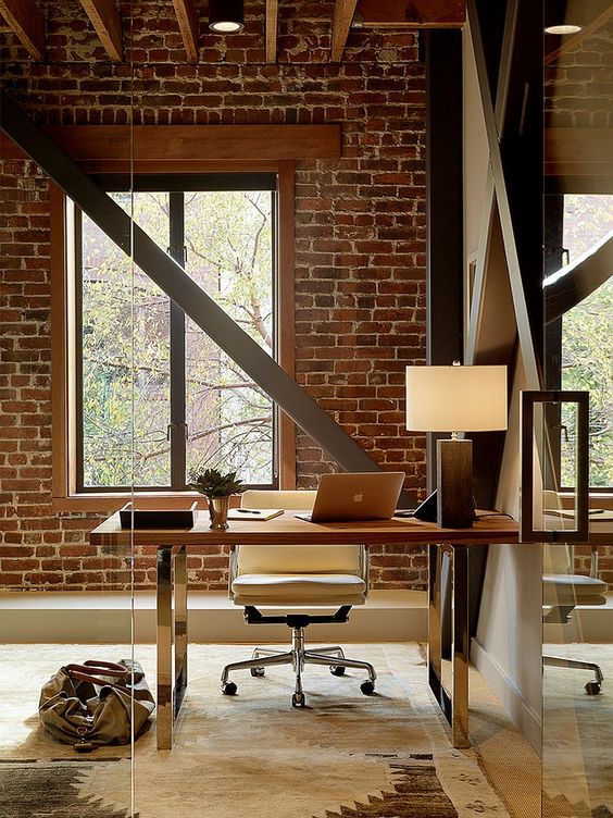 A home office with brick walls is a bold idea with much texture, add beams for more eye catchiness