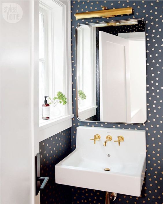 cute polka dot wallpaper will easily spruce up your bathroom or powder room
