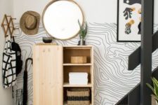 make your entryway stylish with a cool wallpaper on half of a wall