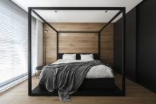 08 The master bedroom is done with wood, a black wall that conceals storage and a glazed wall covered with shades