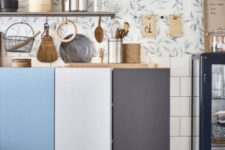 08 floating IKEA Ivar cabinets to comprise a kitchen, each door painted a different color
