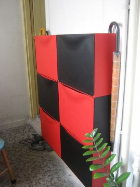 a colorful IKEA Trones hack in red and black will make a bright statement in your entryway