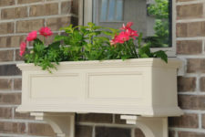 09 a cream-colored molding flower box with pink flowers is a traditional idea to go for