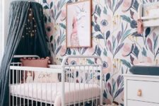 an awesome girl’s nursery design with a canopy bed