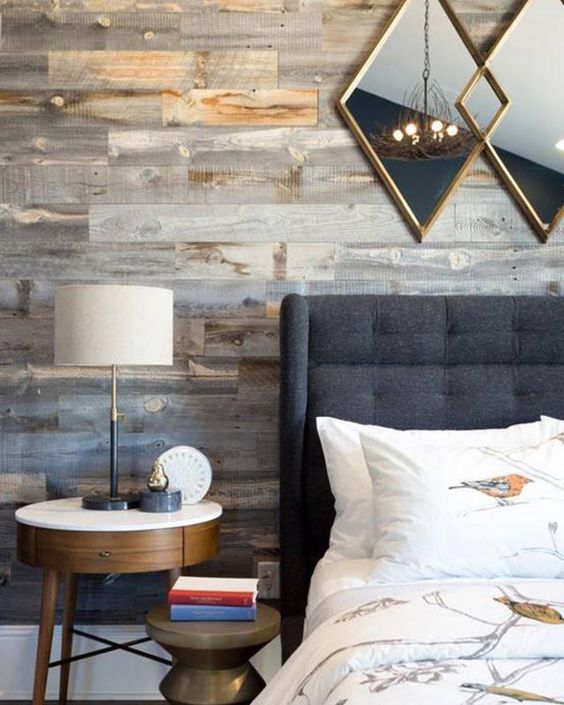a weathered wood statement wall is a great way to add texture and coziness to the bedroom
