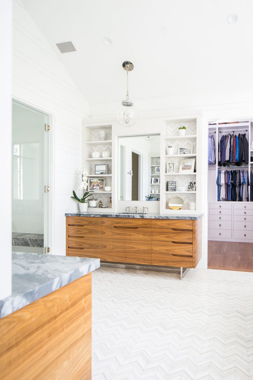 The master bathroom is neutral, with marble countertops
