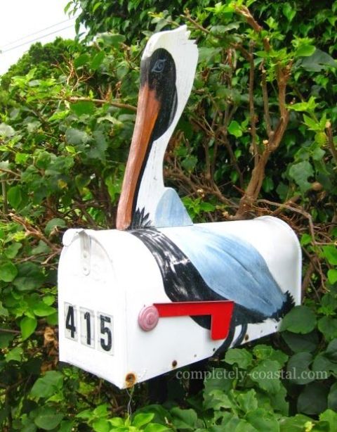 A bright pelican mailbox with house numbers is a cool idea for a coastal or beach home and it looks veyr eye catchy