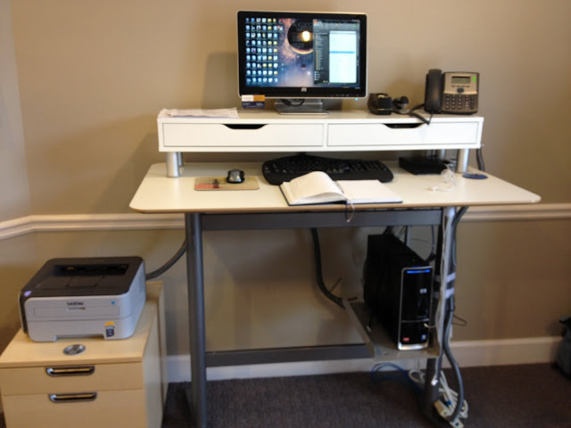 a modern standing workstation with an Ekby Alex unit put on it to make a standing desk