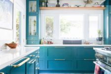 10 bright blue with gold touches will give your kitchen a new life, and white countertops create a contrast