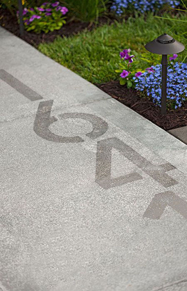 house numbers stenciled into the side walk is a simple and very modern idea, which fits contemporary and minimalist homes