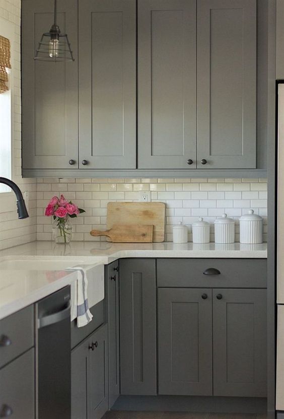 a grey kitchen with white countertops is timeless classics that always works
