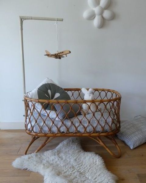 a rattan cradle is a cool boho inspired idea, which will make a stylish statement in your nursery